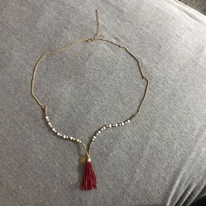 Long beaded with red Tassels and a pendant